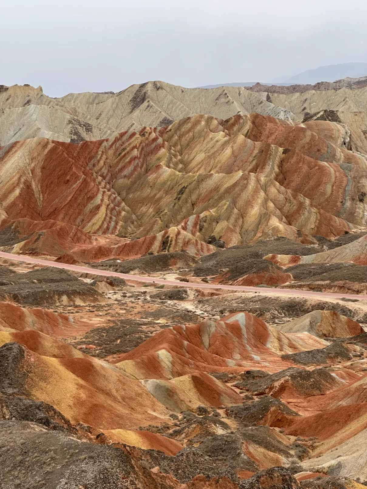 Colorful rocks splitted by a road