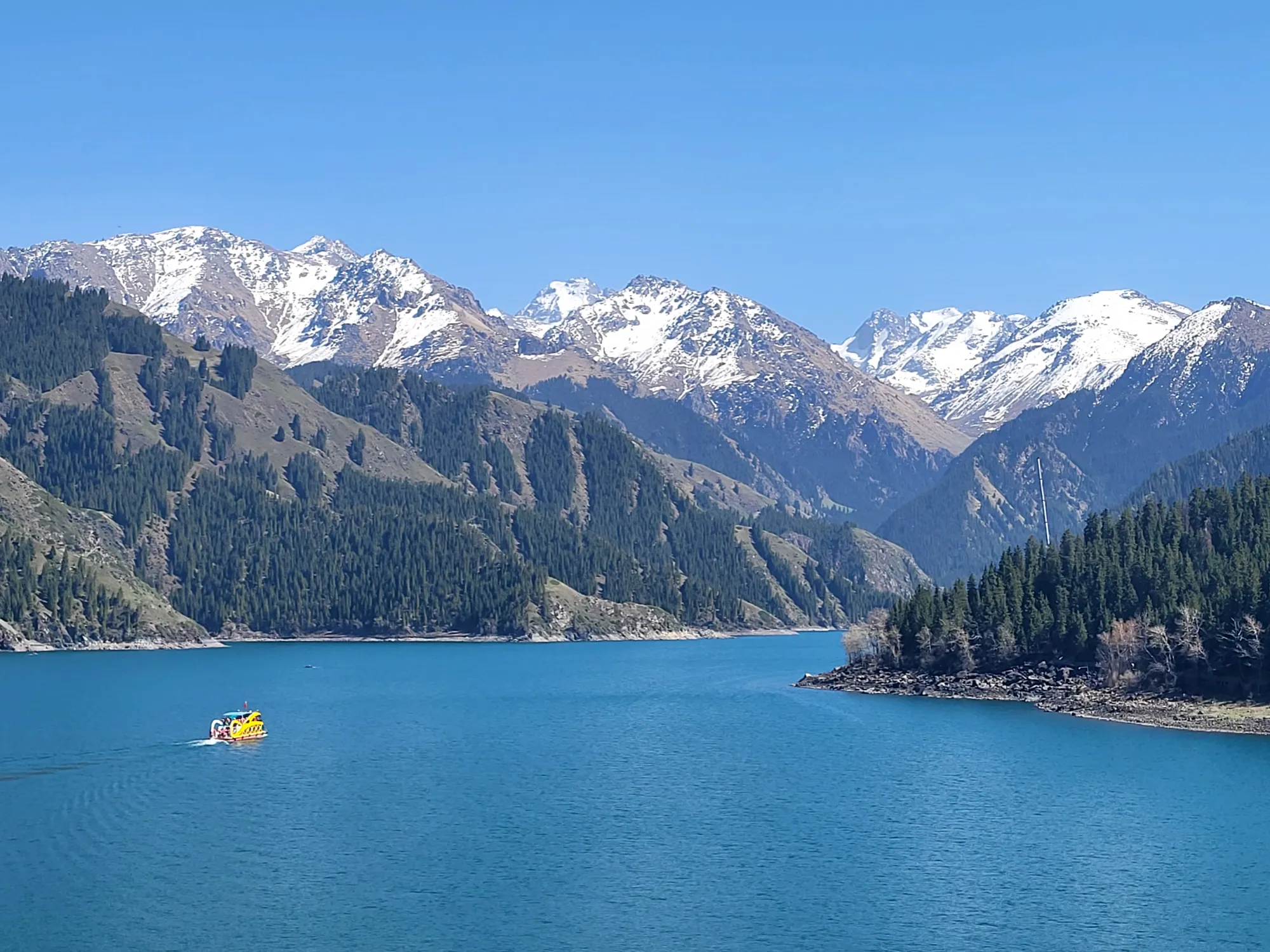 Tianshan Heavenly Lake with a boat