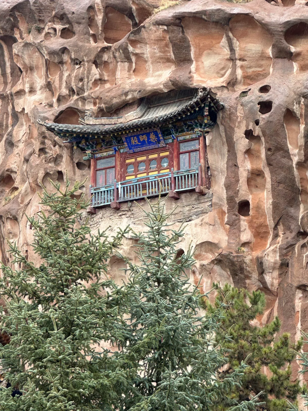 Floating temple behind a tree