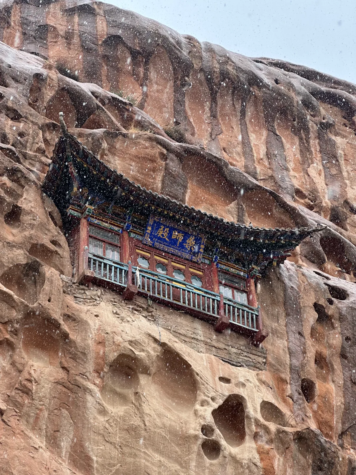 Floating temple in the cliff wall
